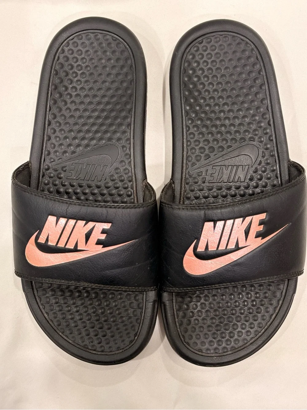 Woman’s Nike Benassi Black and Rose Gold Slides Size 7